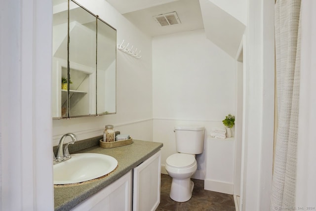 bathroom with toilet and vanity