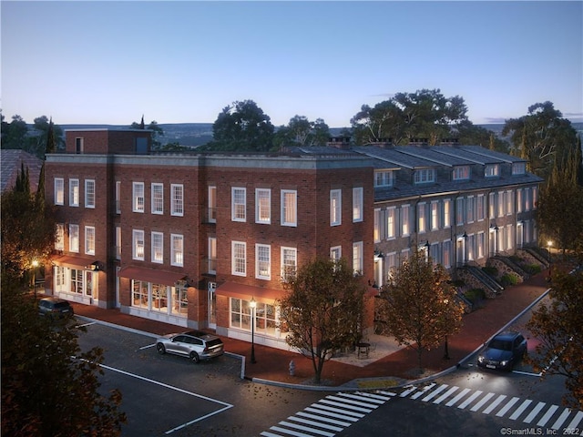 view of outdoor building at dusk