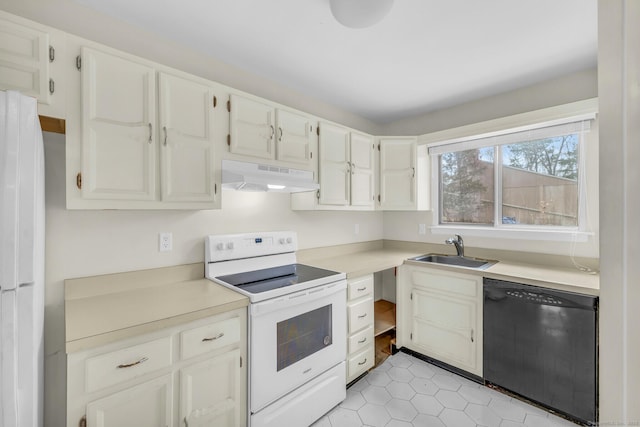 kitchen featuring sink, white appliances, and white cabinets