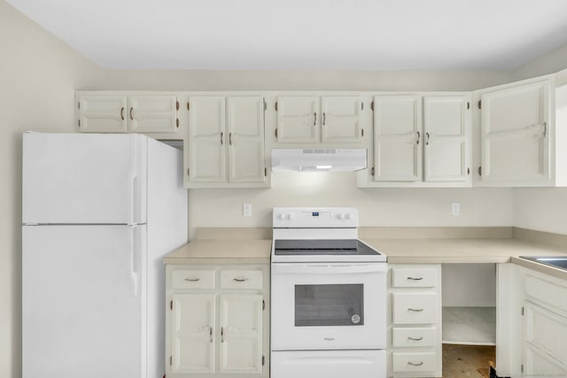 kitchen featuring white cabinetry and white appliances