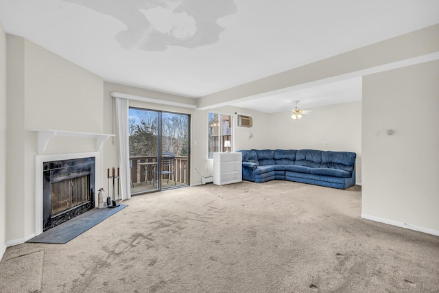 carpeted living room featuring ceiling fan, a wall mounted AC, and baseboard heating