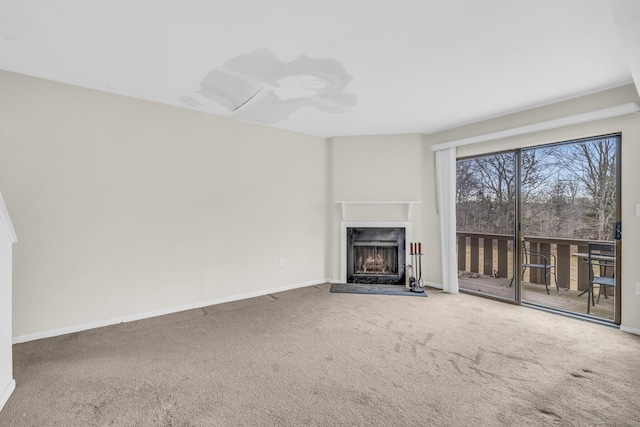 unfurnished living room featuring carpet