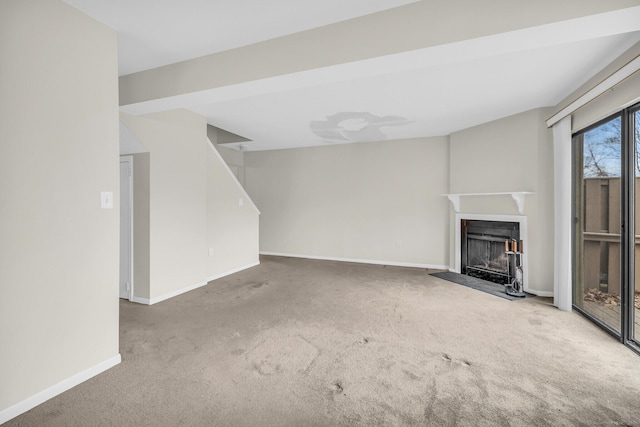 unfurnished living room featuring carpet floors