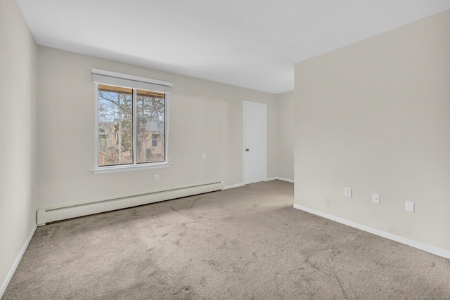 empty room with a baseboard radiator and carpet floors