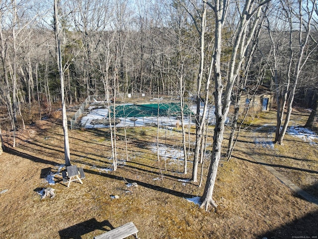 view of yard with a covered pool