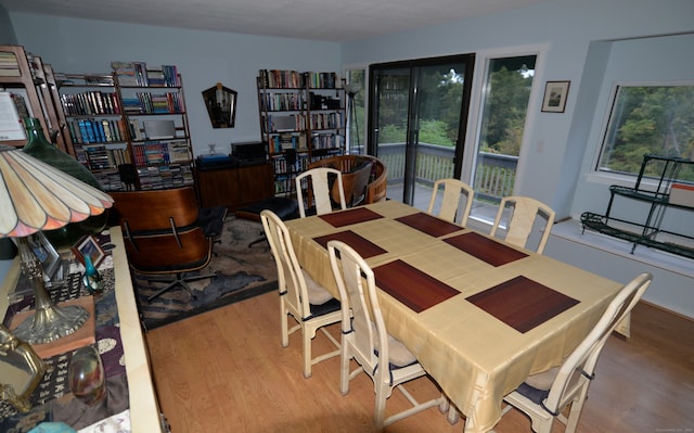 dining space with hardwood / wood-style flooring