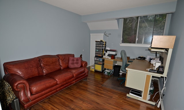 home office with lofted ceiling and dark hardwood / wood-style floors