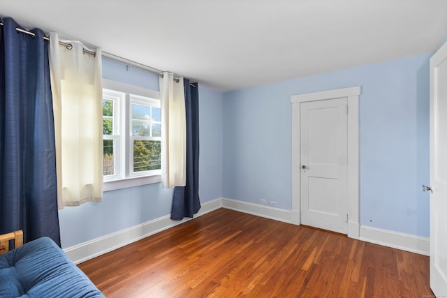 empty room featuring dark hardwood / wood-style flooring