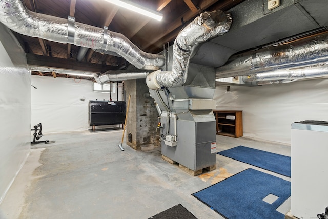 basement featuring heating unit