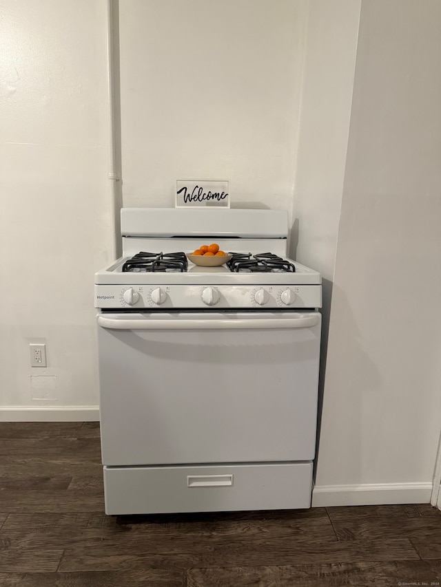 interior space featuring white gas range oven and dark hardwood / wood-style floors