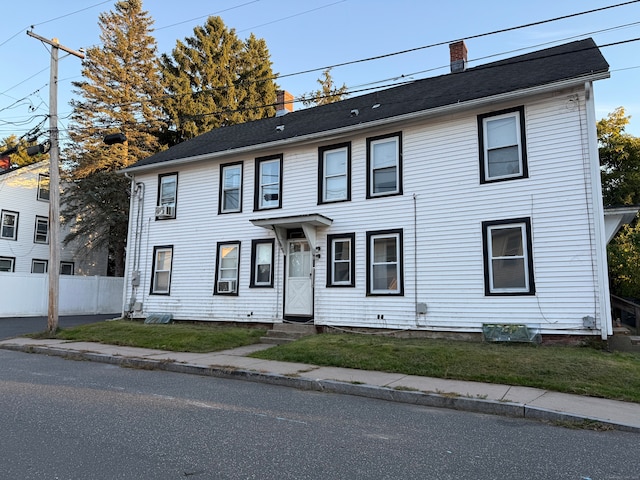 colonial home featuring cooling unit