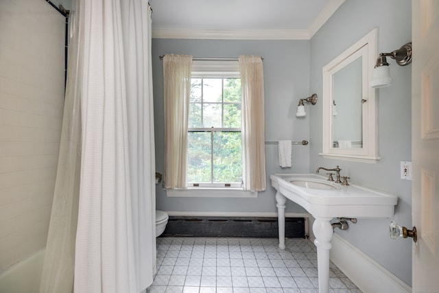 bathroom with ornamental molding, tile patterned floors, shower / bath combo with shower curtain, and toilet