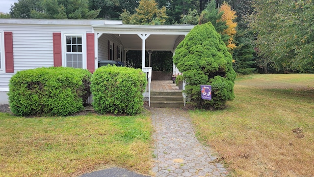 1 Circle Dr, Windham, CT 06256 - property entrance with covered porch and a yard