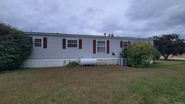 1 Circle Dr, Windham, CT 06256 - rear view of house with central air condition unit and a yard