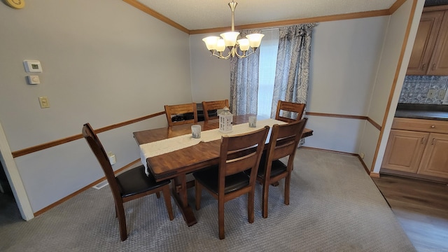 1 Circle Dr, Windham, CT 06256 - dining space featuring an inviting chandelier, baseboards, and crown molding