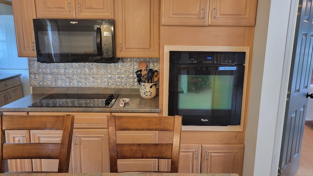 1 Circle Dr, Windham, CT 06256 - kitchen with backsplash and black appliances