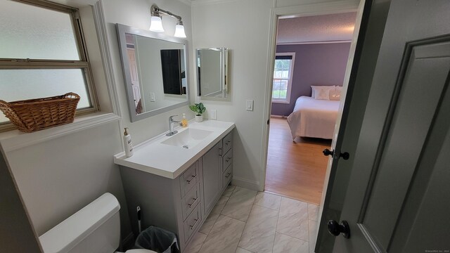1 Circle Dr, Windham, CT 06256 - bathroom with toilet, marble finish floor, vanity, crown molding, and baseboards