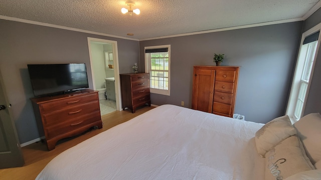 1 Circle Dr, Windham, CT 06256 - bedroom with wood finished floors, ornamental molding, a textured ceiling, ensuite bath, and baseboards