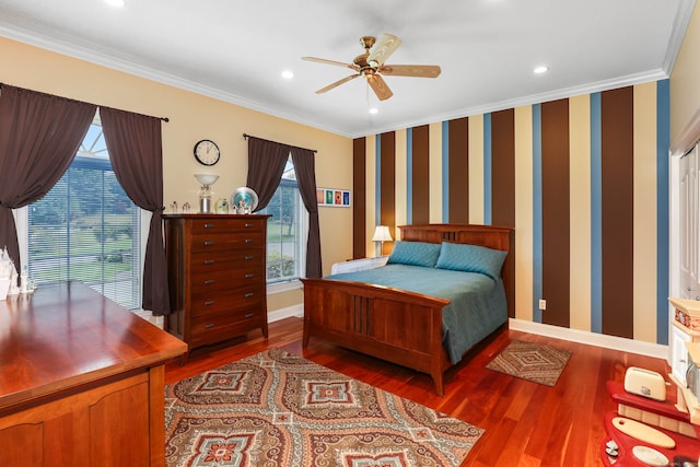 bedroom with ornamental molding, wood-type flooring, and ceiling fan