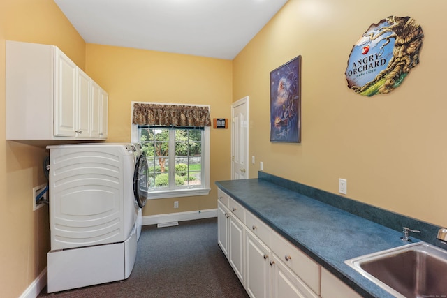 laundry room featuring washer / clothes dryer, sink, dark carpet, and cabinets