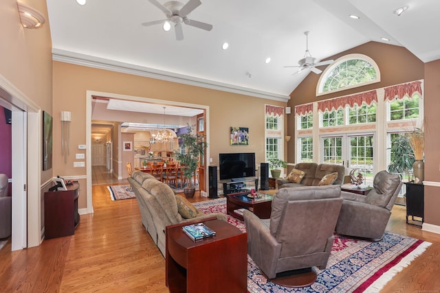 living room featuring light hardwood / wood-style flooring, ceiling fan, and high vaulted ceiling