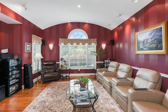 living room with lofted ceiling and hardwood / wood-style floors