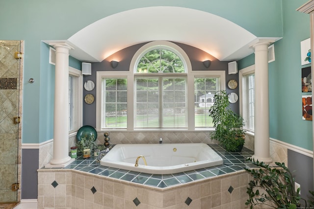 bathroom with separate shower and tub and ornate columns