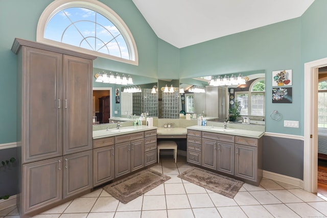 bathroom with vanity, tile patterned floors, and a wealth of natural light