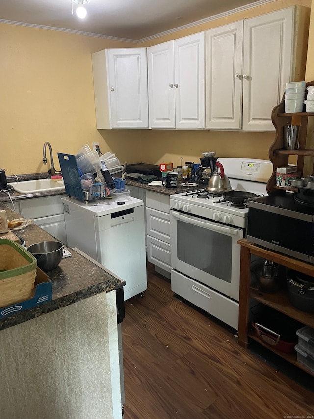 kitchen with sink, dark hardwood / wood-style flooring, white appliances, and white cabinetry