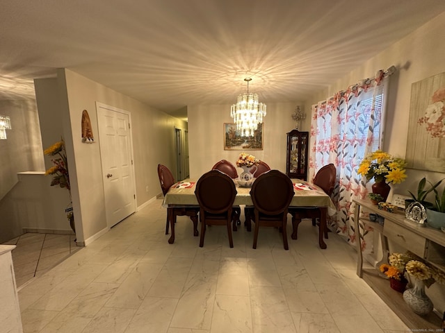 dining space with an inviting chandelier