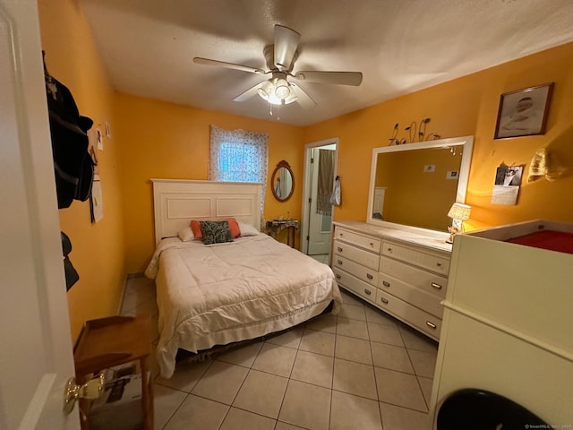 tiled bedroom featuring ceiling fan