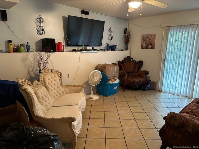 living room with ceiling fan and light tile patterned floors