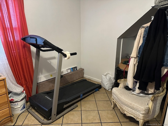 workout area with light tile patterned floors