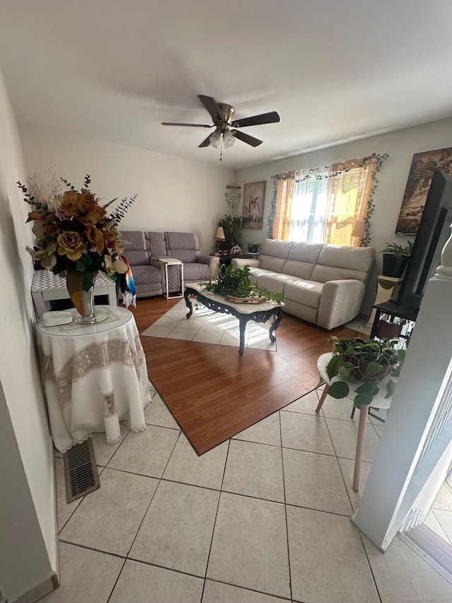 living room with hardwood / wood-style flooring and ceiling fan