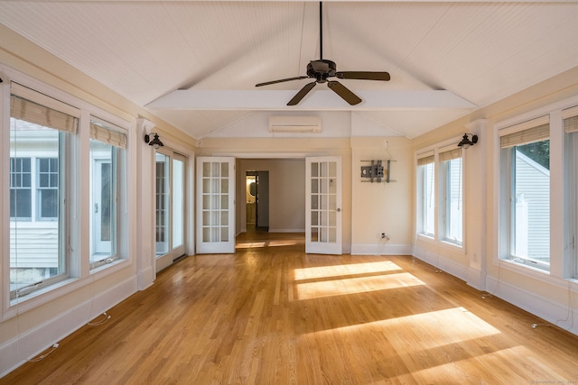 unfurnished sunroom featuring an AC wall unit, vaulted ceiling with beams, and ceiling fan