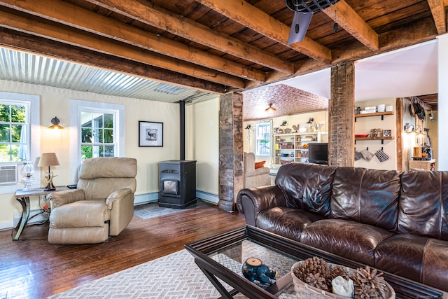 living room with wood ceiling, a baseboard heating unit, dark hardwood / wood-style floors, beamed ceiling, and a wood stove