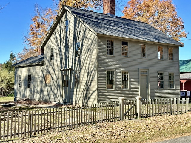 27 Middle Quarter Rd, Woodbury, CT 06798 - view of side of property featuring a chimney, a fenced front yard, and a shingled roof