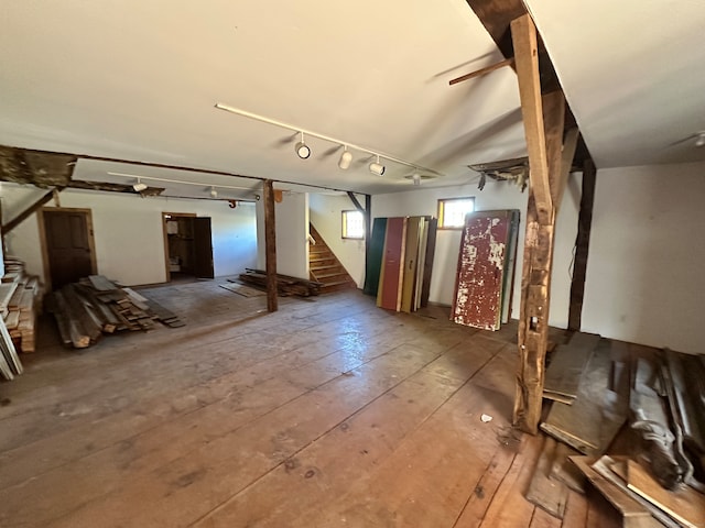 basement with hardwood / wood-style flooring