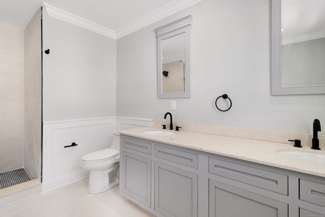 bathroom with ornamental molding, vanity, and toilet