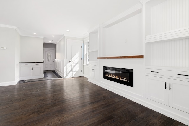 unfurnished living room featuring crown molding and dark hardwood / wood-style flooring