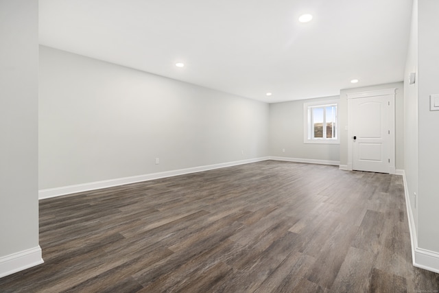 empty room with dark wood-type flooring