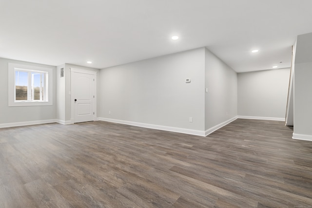 empty room featuring dark wood-type flooring