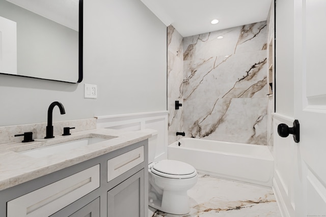 full bathroom featuring vanity, toilet, and tiled shower / bath