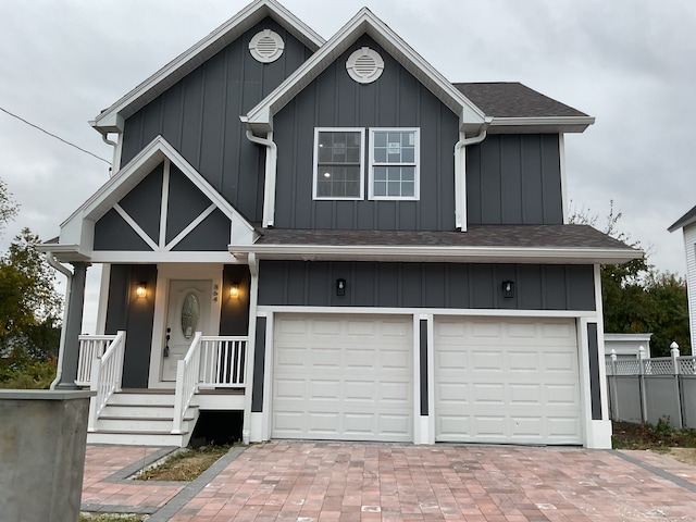 view of front of property featuring a porch and a garage