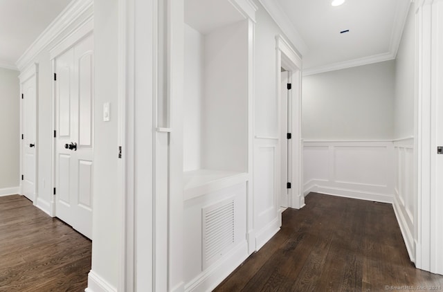 hallway with ornamental molding and dark wood-type flooring