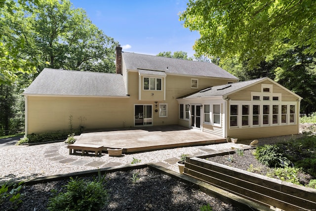 back of house featuring a wooden deck