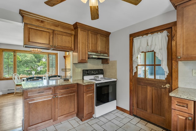 kitchen with ceiling fan, electric stove, light stone countertops, and decorative backsplash