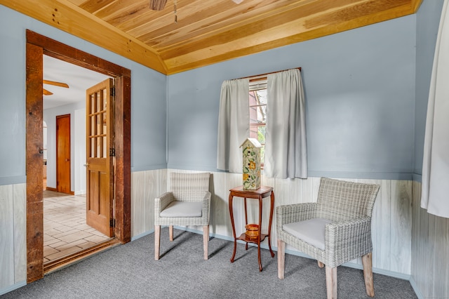 sitting room with ceiling fan and light carpet