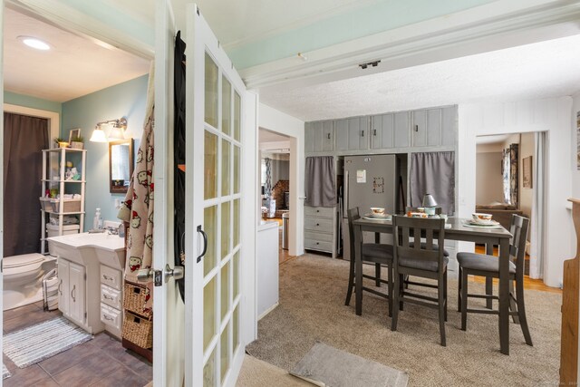 view of carpeted dining area