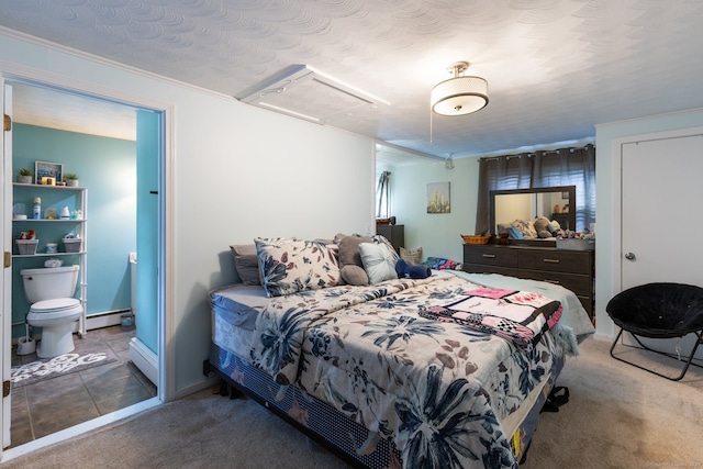 bedroom with a baseboard radiator, a textured ceiling, carpet floors, and crown molding